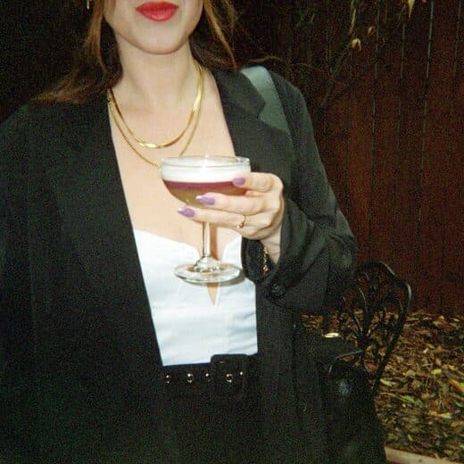 A guest holding a cocktail