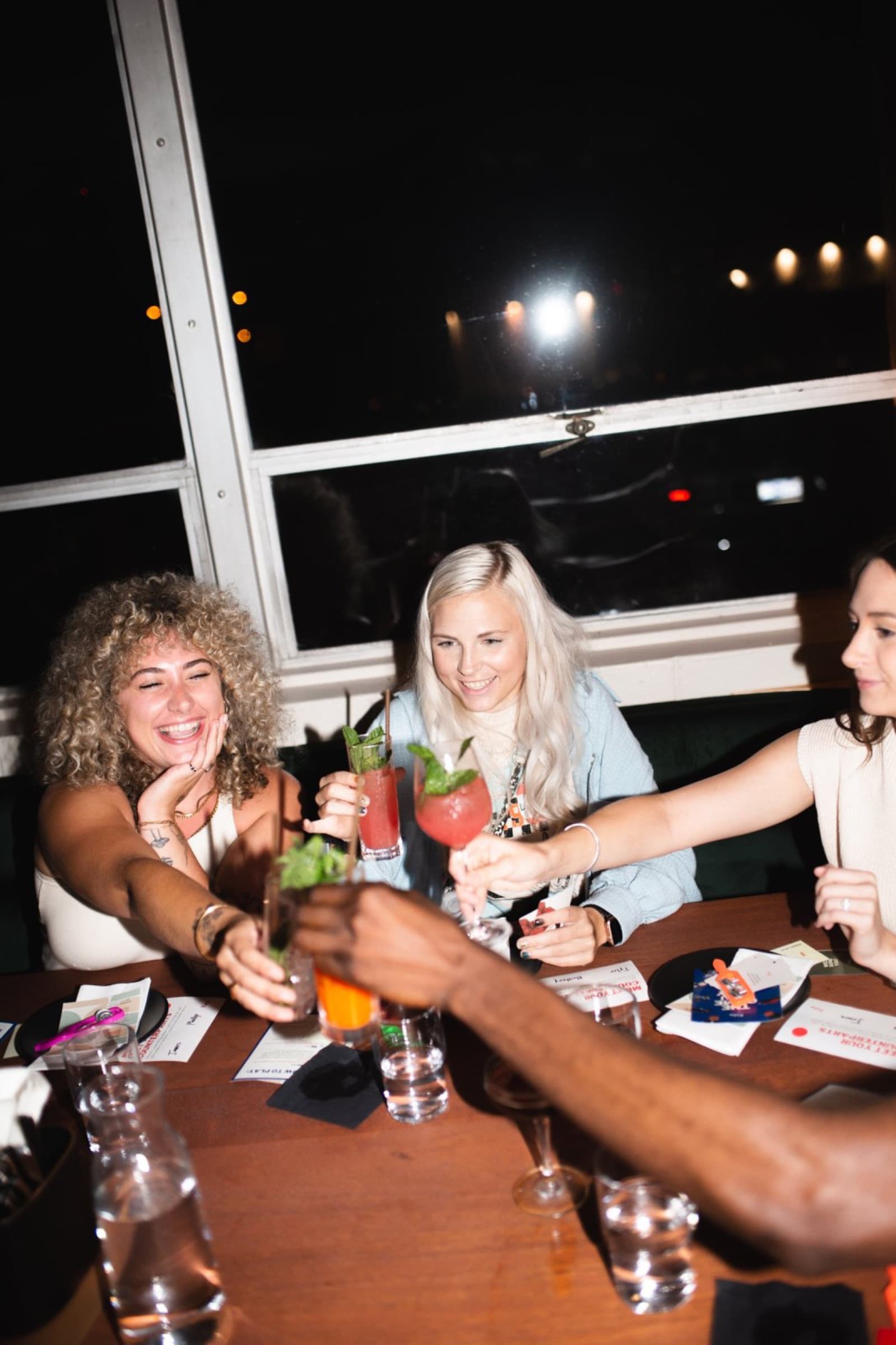 Guests toasting at a small table